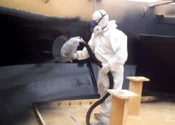 Spray coating water tank with polyurethane
