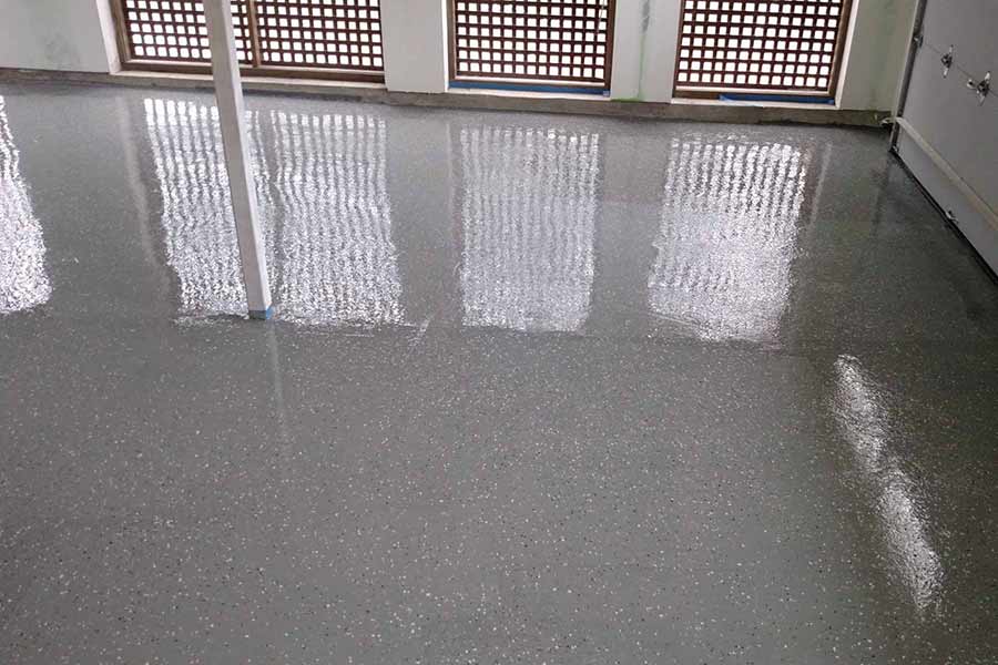 concrete coating glossy with paint chips
