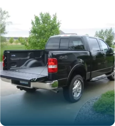 Black pickup truck with open tailgate