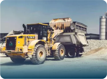 Loader and truck on construction site