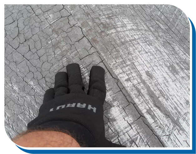 Inspecting Roof Surface for Cracks and Damage