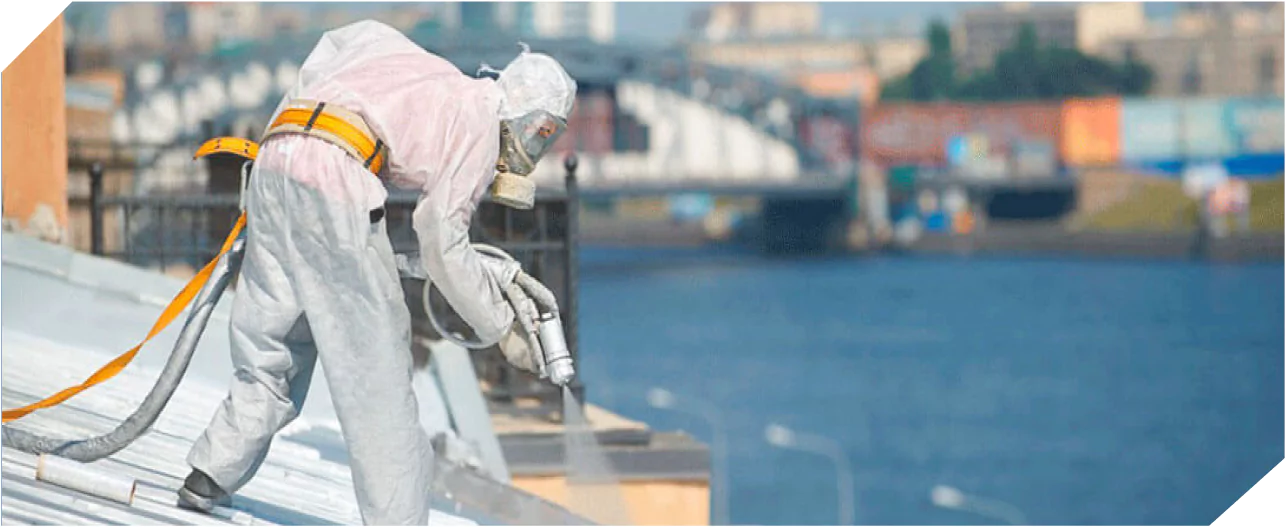 Workers applying Polyurea roof waterproofing