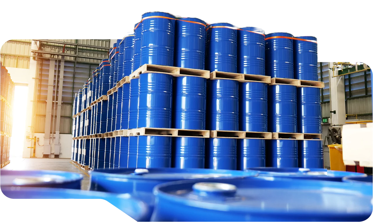 Stacked blue industrial barrels in warehouse